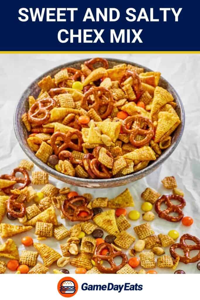 A bowl of sweet and salty chex mix and some scattered in front of it.